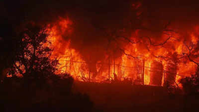 US wildfire: 30,000 ordered to evacuate as blaze rages through Los Angeles hillsides