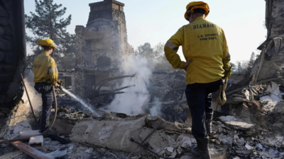 Firefighters scramble to contain California wildfires before winds return