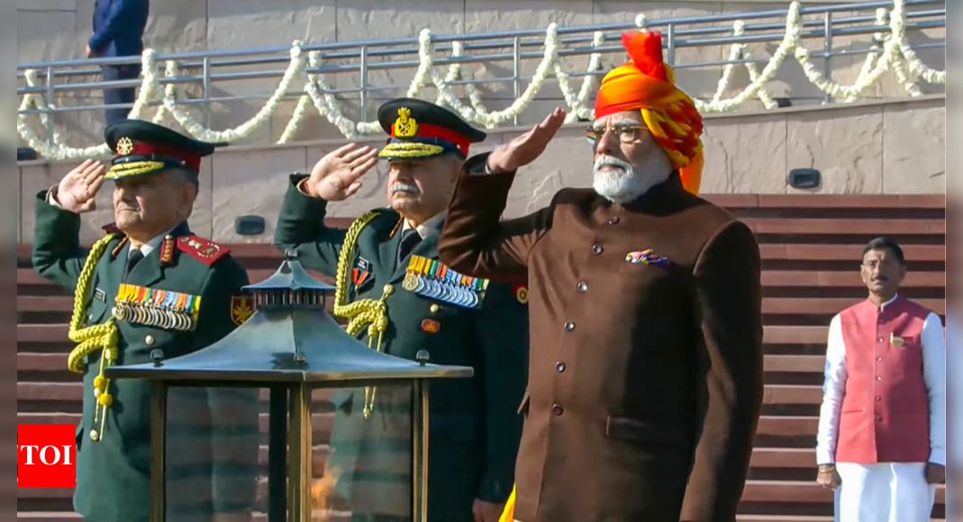 76th Republic Day: PM Modi dons yellow-red striped 'safa' and brown jacket