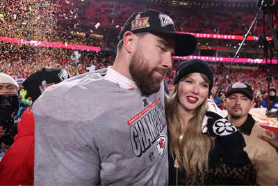 Taylor Swift and Travis Kelce share PDA filled moment on the field of Arrowhead Stadium after the Kansas City Chiefs defeated the Buffalo Bills