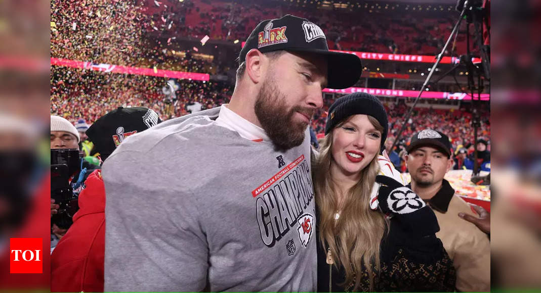 Taylor Swift and Travis Kelce share PDA filled moment on the field of Arrowhead Stadium after the Kansas City Chiefs defeated the Buffalo Bills