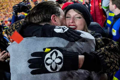 Taylor Swift's most exuberant hug after the Chiefs win over the Bills went to a different man, not boyfriend Travis Kelce