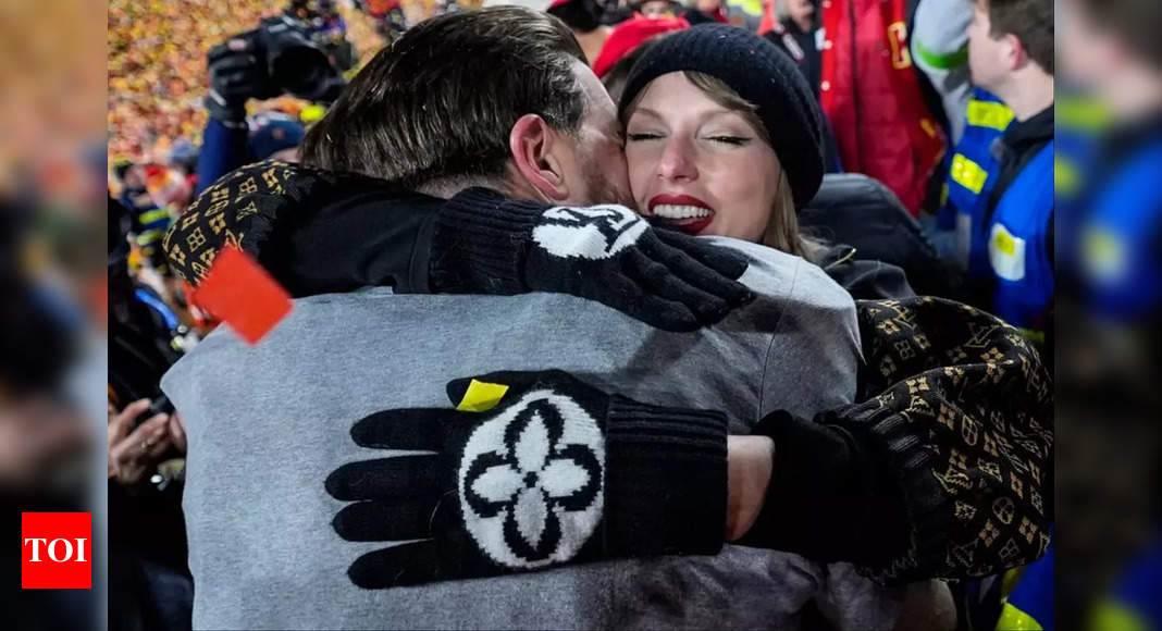 Taylor Swift's most exuberant hug after the Chiefs win over the Bills went to a different man, not boyfriend Travis Kelce