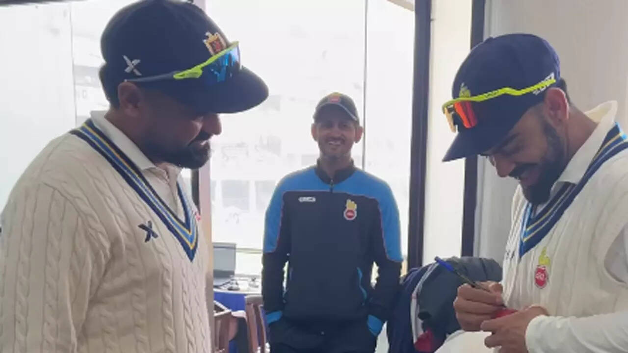 Himanshu Sangwan's fan moment, takes Virat Kohli's autograph after dismissing him in Ranji Trophy | Cricket News - The Times of India