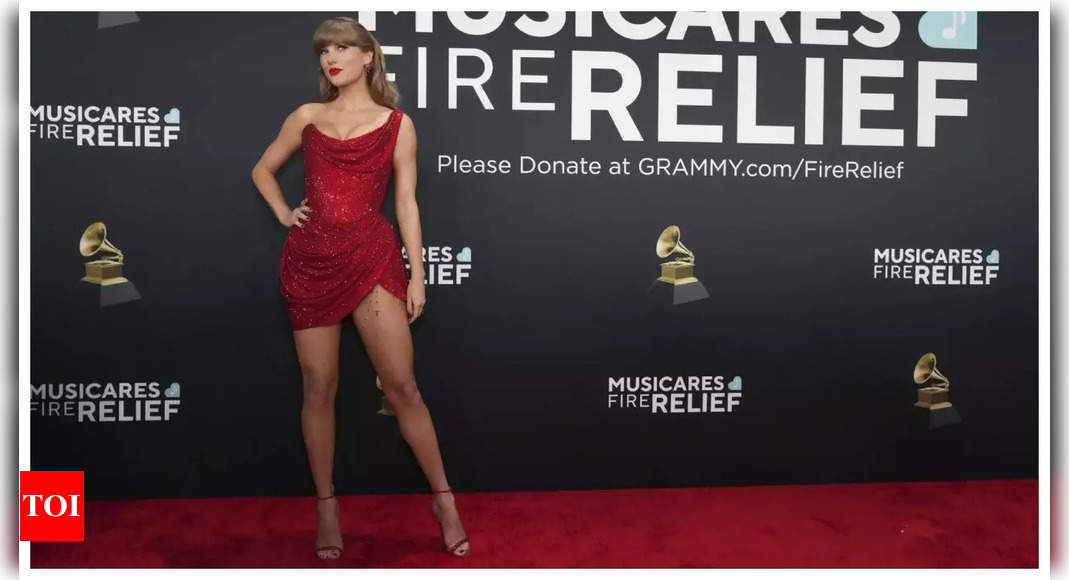 Taylor Swift scorches up Grammys 2025 red carpet in daring red mini-dress; accept rose from fan - WATCH