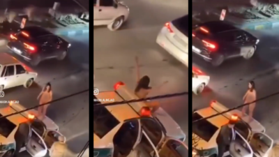 Iranian woman protests hijab laws by stripping naked and jumping on