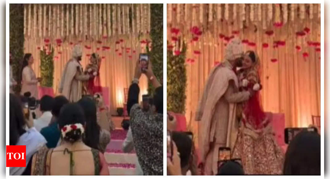 Priyanka Chopra's brother Siddharth Chopra kisses his bride Neelam Upadhyaya after jaimala ceremony- WATCH video