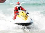Santa Claus enjoys a jet-ski ride