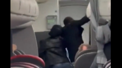 Watch: American Airlines Passenger attacked the crew, swallows Rosary Beeds, 'Satan chased her on the plane'