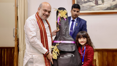  Amit Shah gifts guitar to Mizoram's 7-year-old singing sensation