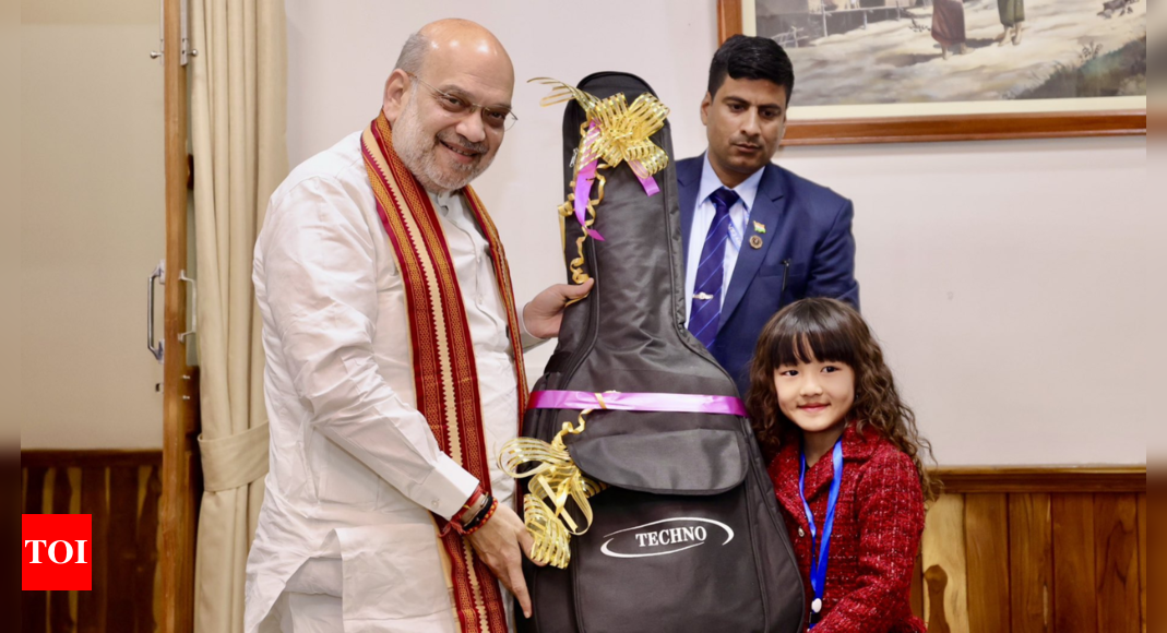 Amit Shah gifts guitar to Mizoram's 7-year-old singing sensation