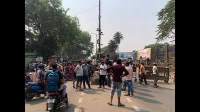 Residents stage road blockade over railway crossing closure