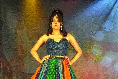 College students walk the ramp at a fashion show organised by students ...