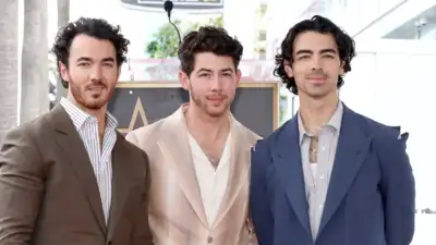 The Jonas Brothers BEGIN 20th Anniversary Celebrations by Lighting Up the Empire State Building