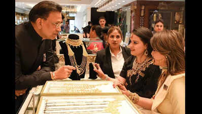 Festive sales of gold up for a dull season as price hovers around ...