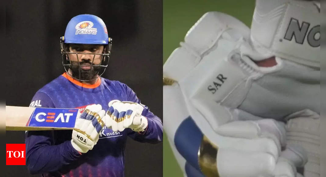 What does 'SAR' on Rohit Sharma's gloves mean?