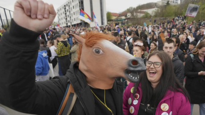 Protesting students in Serbia rally outside pro-government media outlet and stage 'decontamination'