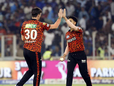 Sunrisers Hyderabad's captain Pat Cummins, with a teammate, celebrate the wicket of Gujarat Titans' Jos Buttler during their IPL 2025 match at Narendra Modi Stadium in Ahmedabad. (ANI) IPL 2025: With seven defeats in 10 matches, are SRH out of playoff race?