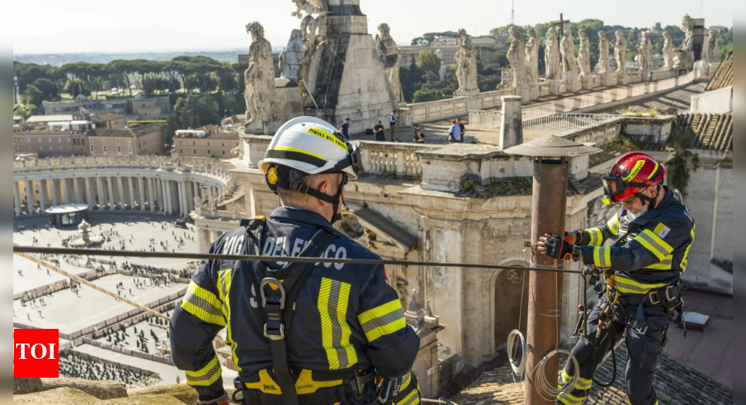Vatican workers install Sistine Chapel stove where ballots are burned during conclave to elect pope |