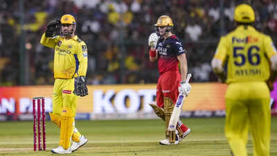 MS Dhoni (L) gestures to change the field during the IPL 2025 match between Royal Challengers Bengaluru and Chennai Super Kings at Chinnaswamy Stadium. (PTI) Pissed off MS Dhoni yells at Khaleel Ahmed: 'Udhar kisi ko fielding karte dekha hai?' - watch