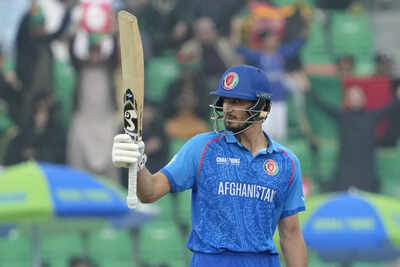 Afghanistan's Sediqullah Atal celebrates after scoring fifty during the ICC Champions Trophy cricket match between Australia and Afghanistan, in Lahore, Pakistan. AP/PTI IPL 2025: Who is Delhi Capitals new Afghan recruit Sediqullah Atal?