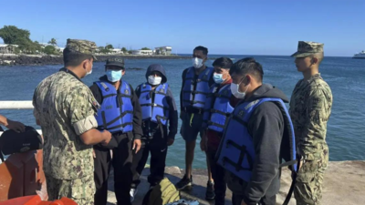 Five fishermen who spent 55 days adrift at sea arrive in the Galapagos Islands after rescue