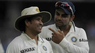 Sachin Tendulkar and Virat Kohli (AFP Photo) 'A thread from your late father': Sachin Tendulkar reveals Virat Kohli's unseen tribute during his last Test