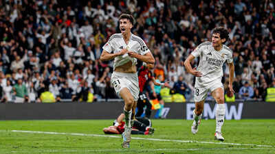 Real Madrid stay alive in title race with last-minute win in La ...