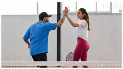 Anushka Sharma and Virat Kohli caught in a perfect high-five moment as they team up for a game of pickleball; fan calls them 'King and Queen'