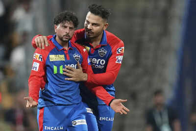 Delhi Capitals' Kuldeep Yadav (L) celebrates the dismissal of Mumbai Indians' Ryan Rickelton during the Indian Premier League cricket match. (AP) Kuldeep Yadav becomes 11th spinner to 100 IPL wickets