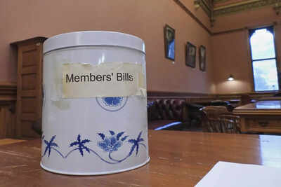 In New Zealand's Parliament, a battered cookie tin decides which new laws get debated