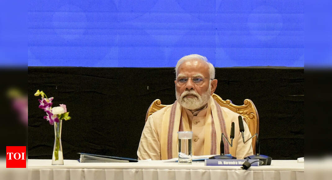 Modi Greets Col. Qureshi's Family at Roadshow