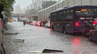 Trains crawl, roads waterlogged, buses diverted as Mumbai reels under heavy rain; 'yellow' alert upgraded to 'orange'