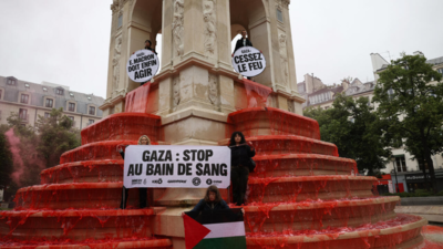 Activists turn Paris fountain red to denounce Gaza 'bloodbath'