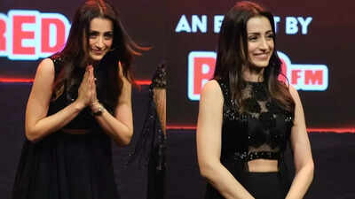Trisha can't hold back tears listening to Ghilli’s iconic tune at 'Thug Life' Kerala promotions