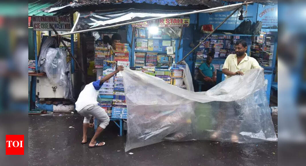 Kolkata Booksellers Protect Stock as Early Rain Brings Flood Fears