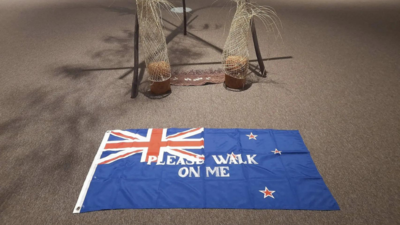 Protests over 'please walk on me' flag artwork prompt its removal from New Zealand gallery- again