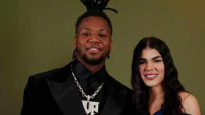 Ronald Acuna Jr. performs under pressure as wife Maria Laborde cheers  at Phillies game in red Braves gear