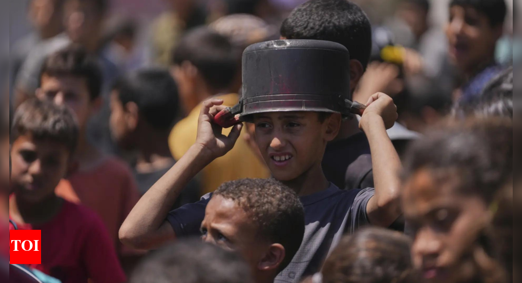 Hungry Palestinians in Gaza block and offload dozens of UN food trucks