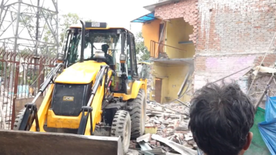 Demolition drive underway at Jangpura’s Madrasi Camp after Delhi HC order to clear slums