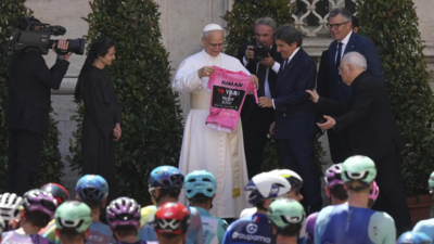 Pope Leo XIV blesses cyclists competing in the Giro d'Italia as final stage enters Vatican gardens