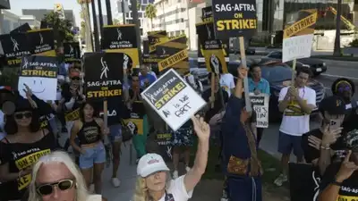 AP file photo AI vs humans: Facing job losses, US unions demand protection; defend worker rights