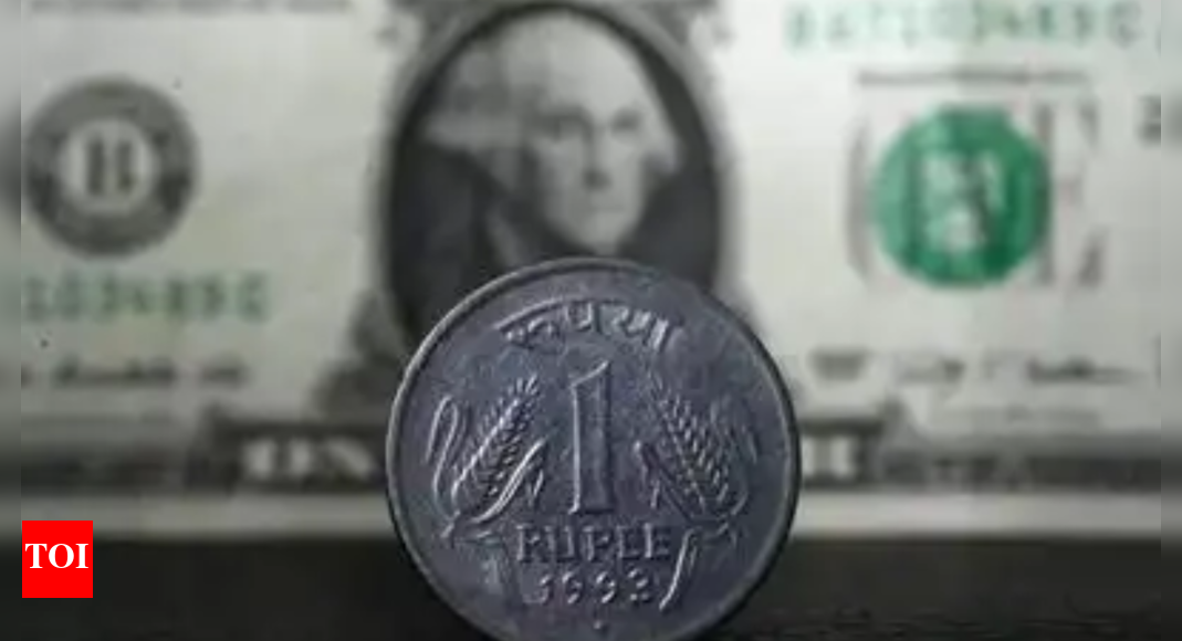 Rupee drops 29 paise to close at 85.90 against US dollar amid risk-off mood, FII outflows – Times of India
