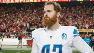 NFL player Jake McQuaide causes scene in church, demands answers in archdiocese porn scandal—escorted out by police