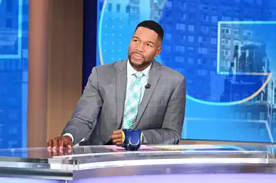 Michael Strahan stands by ESPN host Jay Harris during a heartbreaking announcement that has shocked fans
