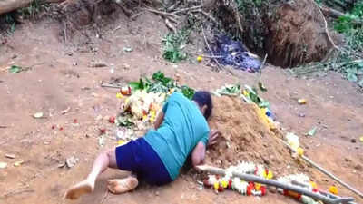 'This land was meant for his future': Father clings to son’s grave who died in Bengaluru stampede; watch