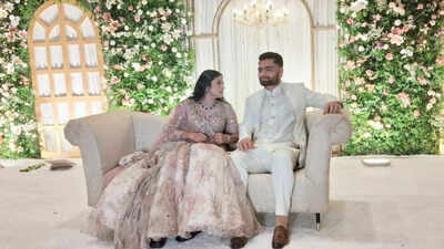 Newly elected MP Priya Saroj's engagement to cricketer Rinku Singh in Lucknow showcased an effortless bridal style. Priya opted for a pastel pink and ivory floral lehenga, balancing fairytale romance with comfort. Her understated jewelry and soft glam complemented the ethereal look. Rinku's crisp white sherwani provided a calming contrast. The couple will reportedly marry in November 2025 in Varanasi. Priya Saroj's dreamy pink lehenga, Rinku Singh's white sherwani: Celebrity couple serve major style goals at their engagement