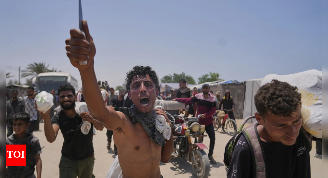 Israel-Gaza conflict: 36 Palestinians killed in gunfire while waiting for aid; 200 injured – Times of India Israel-Gaza conflict: 36 Palestinians killed in gunfire while waiting for aid; 200 injured – Times of India