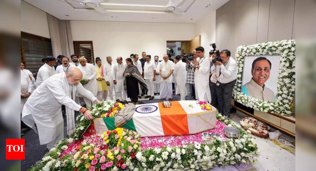Thousands brave rain to pay last respects to Vijay Rupani | Rajkot News ...