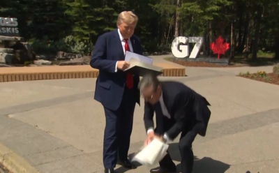 Watch: Starmer scrambles to pick up Trump’s papers as UK-US trade deal signed at G7 Summit; 'Had no choice,' UK PM explains